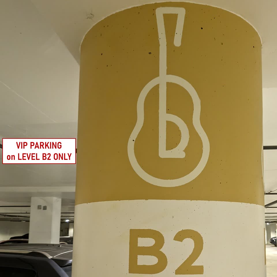 Signage on a pillar in the Whole Foods garage reading: all members and visitors parking on Level B2 only