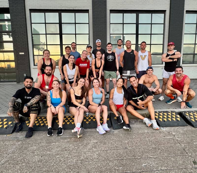 QNTM Run Club members lined up outside before a run